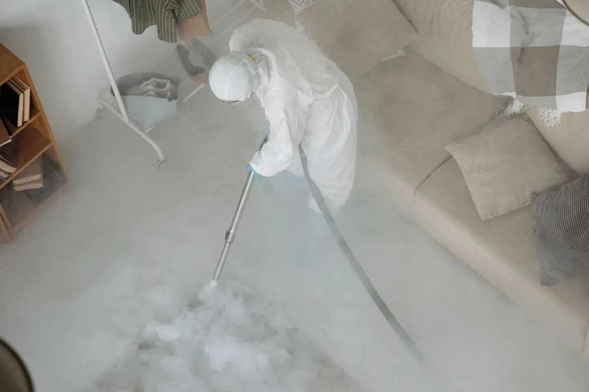Biohazard cleanup technician in protective equipment, Redby, MN